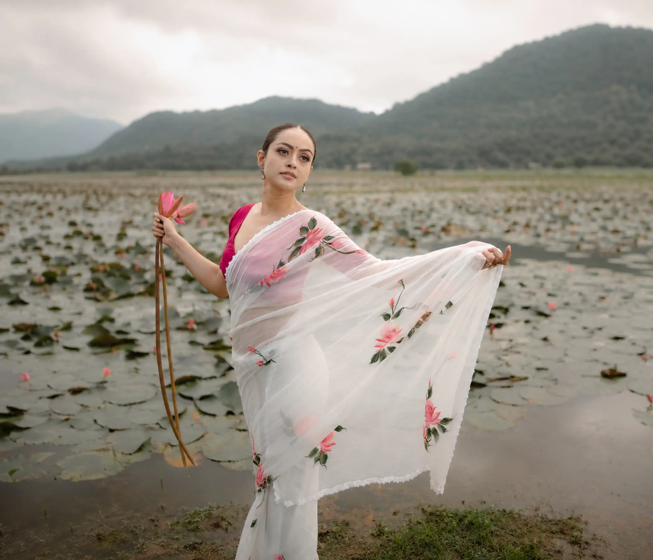 Hand-Painted Pristine White Organza Saree with Pink Lotus Motifs